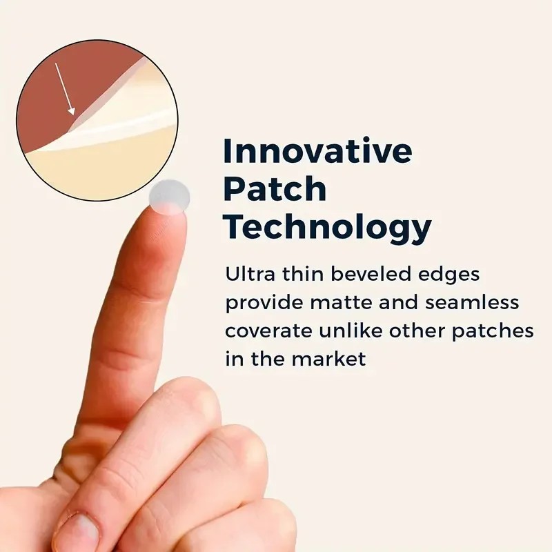 Close-up of a thin clear pimple patch on a fingertip, showing the beveled edge